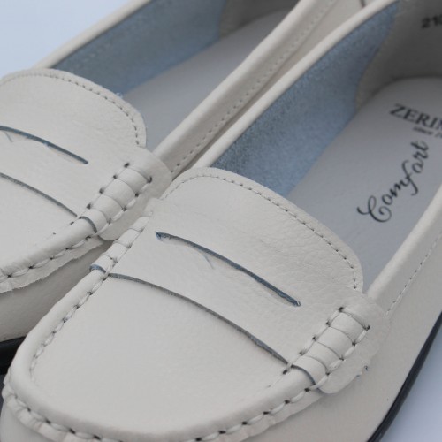 Leather moccasins with black sole