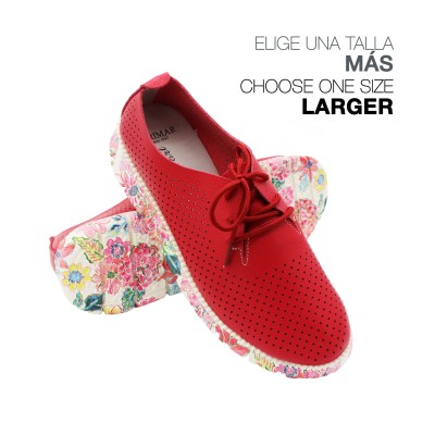 Perforated leather sneakers with flower-pattern sole